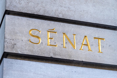 Paris, France - November 13, 2022: Golden engraved sign at the entrance of the French Senate...