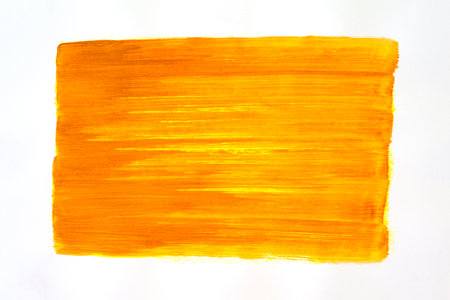 Orange abstract brush strokes painted on white paper background. Texture paper.の写真素材