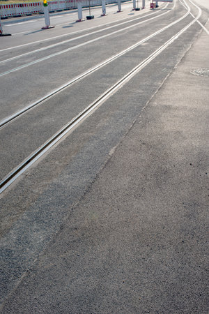 Tram tracks on the road in the city, closeup of photoの写真素材