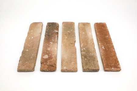 Old brick on white background, closeup of photo. old brickの写真素材