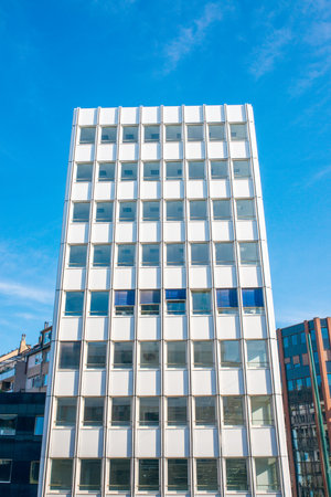 Modern office building on a background of blue sky, London, UKの写真素材