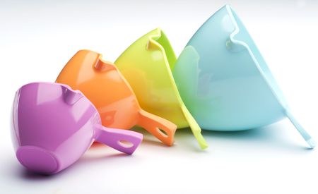 Four Plastic Measuring Cups Laid On A White Backgroundの写真素材