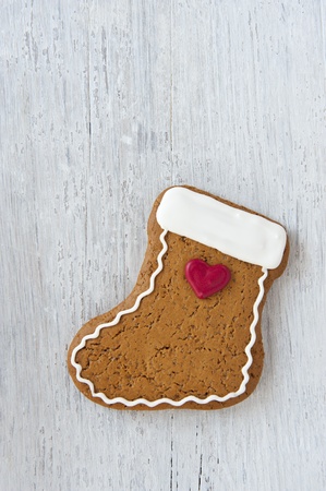 A Homemade Gingerbread Biscuit in the Shape of a Christmas Stockingの写真素材