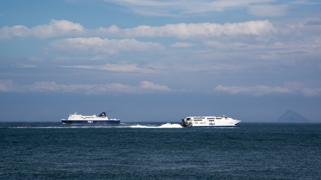 Two Ferries Passing Each Other, On The North Channel, With The Ailsa Craig On The Horizon. Scotland.の写真素材