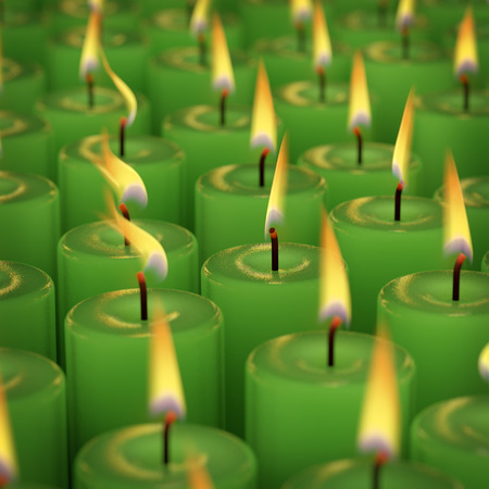 Closeup of burning many candle isolated on black backgroundの写真素材