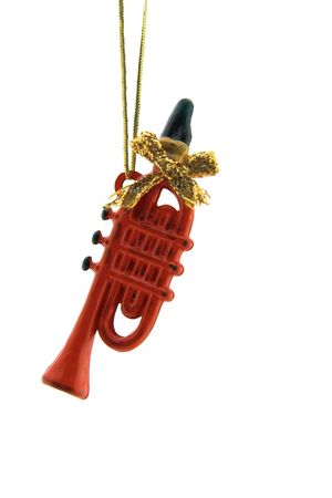 Christmas Decoration - a red trumpet is isolated on a pure white backgroundの写真素材