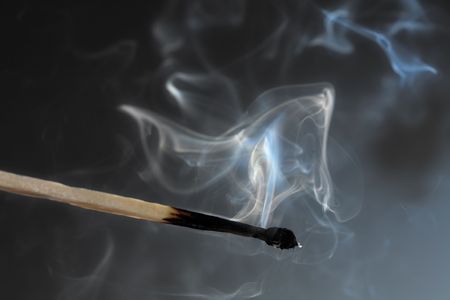 Photo of smoldering match that has just been extinguished.