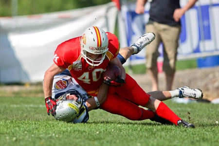 St. Poelten,  AUSTRIA - April 25: Austrian Football League - Division I: SS Hannes Baumgartner (#40, Invaders) and his team win 35:6 against the Traun Steelsharks  on April 25, 2009 in St. Poelten, Austria.のeditorial素材