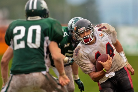 KORNEUBURG,  AUSTRIA - JUNE 20 Austrian Football League: QB DJ Hernandez (#14, Lions) and his team lose 41:35 to the Danube Dragons on June 20, 2009 in Korneuburg, Austria.のeditorial素材