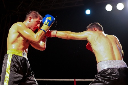 VIENNA, AUSTRIA - OCTOBER 3 Charity Boxing:  Chussein Dombaev (right, Austria) beats Michael Tomko (left, Slovakia) in a  super middelweight fight on October 3, 2009 in Vienna,  Austria.のeditorial素材