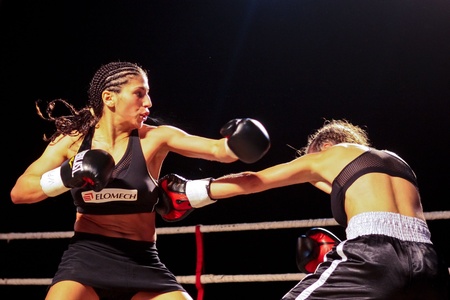 VIENNA, AUSTRIA - OCTOBER 3 Charity Boxing:  Nadia Raoui (left, Germany) beats Fleis Djendji (right, Serbia) in a fly weight fight on October 3, 2009 in Vienna,  Austria.のeditorial素材