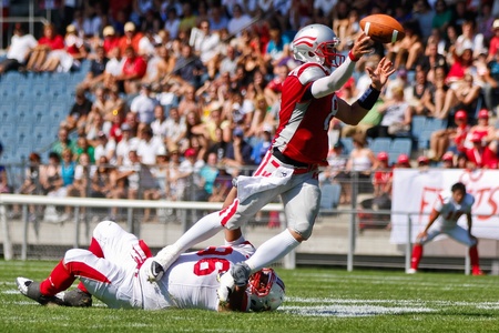 GRAZ, AUSTRIA - JULY 9 QB Christoph Gross (#8 Austria) is tackled at the Football World Championship on July 9, 2011 in Graz, Austria. Japan wins 24:6 against Austria.のeditorial素材
