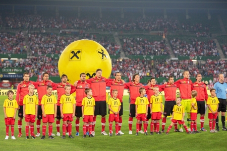 VIENNA,  AUSTRIA - AUGUST 15 The Austrian team during the national anthem before the friendly soccer game on August 15, 2012 in Vienna, Austria.のeditorial素材