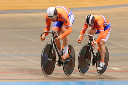 VIENNA,  AUSTRIA - SEPTEMBER 27  Hugo Haag and Jeffrey Hoogland (Netherlands) compete in the men's team sprint event of an indoor cycling meeting on September 27, 2012 in Vienna, Austria.のeditorial素材