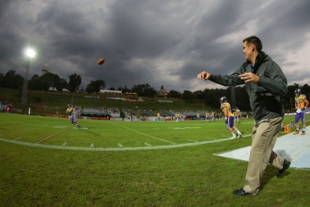 VIENNA, AUSTRIA - JULY 28 Head Coach Chris Calaycay passes the ball to LB Simon Blach (#49 Vikings)...
