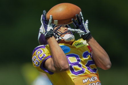 VIENNA,  AUSTRIA - MAY 26 WR Laurinho Walch (#82 Vikings) catches the ball during the EFL football game on May 26, 2013 in Vienna, Austria.のeditorial素材