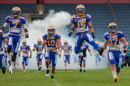 GRAZ, AUSTRIA - JUNE 29 The team of Graz Giants enter the stadium before the playoff game of the AFL on June 29, 2013 in Graz, Austria.のeditorial素材