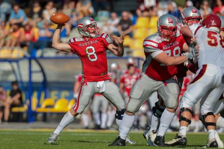 VIENNA, AUSTRIA - MAY 26, 2014: QB Christoph Gross (#8 Austria) passed the ball.のeditorial素材