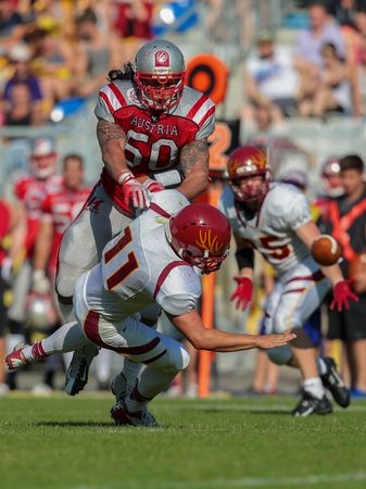 VIENNA, AUSTRIA - MAY 26, 2014: LB Ramon Azim (#50 Austria) makes a tackle.のeditorial素材