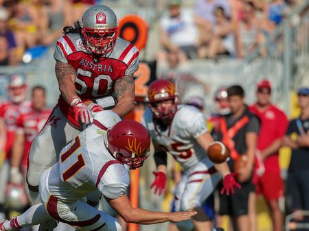 VIENNA, AUSTRIA - MAY 26, 2014: LB Ramon Azim (#50 Austria) makes a tackle.のeditorial素材