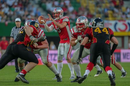VIENNA, AUSTRIA - JUNE 7, 2014: QB Christoph Gross (#8 Austria) catches the ball.のeditorial素材