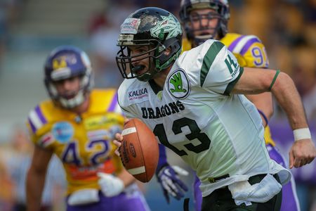 VIENNA, AUSTRIA - JUNE 22, 2014: WR Thomas Haider (#13 Dragons) runs with the ball.のeditorial素材