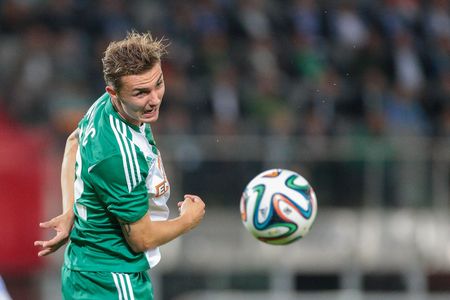 VIENNA, AUSTRIA - AUGUST 28, 2014: Mario Pavelic (#22 Rapid) heads the ball in an UEFA Europa League qualifying game.のeditorial素材