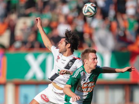 VIENNA, AUSTRIA - SEPTEMBER 20, 2014: Nemanja Rnic (#15 Wolfsberg) and Robert Beric (#9 Rapid) fight for the ball in an Austrian soccer league game.のeditorial素材