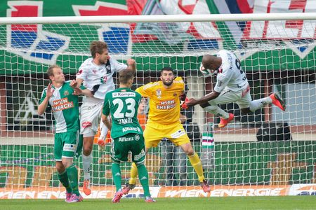 VIENNA, AUSTRIA - SEPTEMBER 20, 2014: Silvio de Oliveira (#8 Wolfsberg) tries to score a goal in an Austrian soccer league game.のeditorial素材