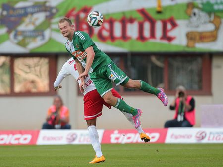 VIENNA, AUSTRIA - SEPTEMBER 28, 2014: Alan (#27 Salzburg) and Mario Sonnleitner (#6 Rapid) fight for the ball in an Austrian soccer league game.のeditorial素材