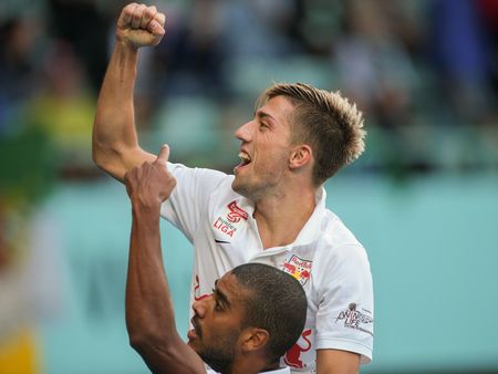 VIENNA, AUSTRIA - SEPTEMBER 28, 2014: Alan (#27 Salzburg) and Kevin Kampl (#44 Salzburg) celebrate after scoring a goal in an Austrian soccer league game.のeditorial素材