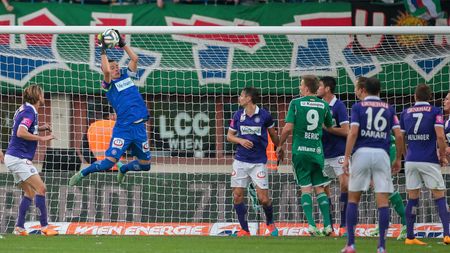 VIENNA, AUSTRIA - NOVEMBER 9, 2014: Heinz Lindner (#13 Austria) catches the ball in an Austrian soccer league game.のeditorial素材