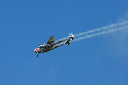 SPIELBERG, AUSTRIA - OCTOBER 26, 2014: Lockheed P-38 Lightning flys in a flight display during the Red Bull Air Race.のeditorial素材