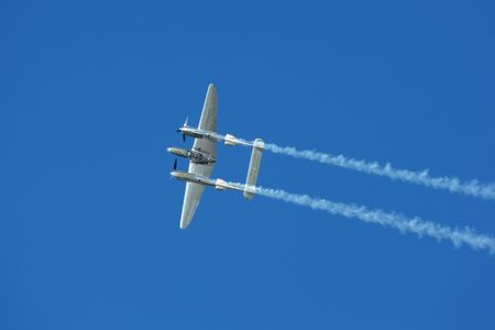 SPIELBERG, AUSTRIA - OCTOBER 26, 2014: Lockheed P-38 Lightning flys in a flight display during the Red Bull Air Race.のeditorial素材