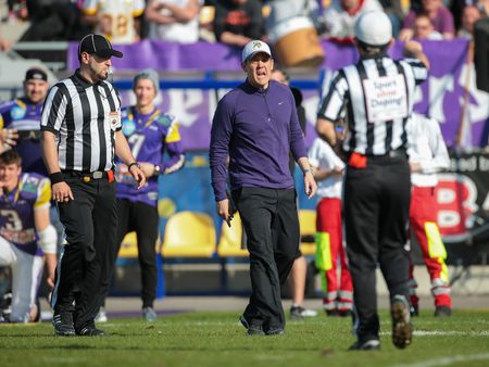 VIENNA, AUSTRIA - APRIL 19, 2015: Head Coach Chris Calacay has a dsicussion with Head Referee Savicevic in a game of the Austrian Football League.のeditorial素材