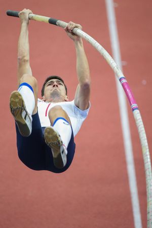 PRAGUE, CZECH REPUBLIC - MARCH 8, 2015: Bastien Auzeil (# France)  competes in the men's pole vault event of the European Athletics Indoor Championship.のeditorial素材