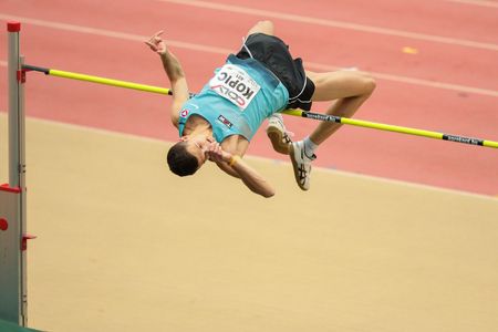 LINZ, AUSTRIA - FEBRUARY 6, 2015: Josip Kopic (#401 Austria) competes in the men's high jump event in an indoor track and field event.のeditorial素材