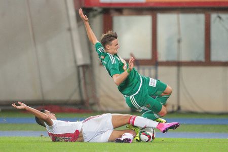 VIENNA, AUSTRIA - JULY 29, 2015: Anwar El Ghazi (Ajax) and Stefan Stangl (SK Rapid) fight for the ball in an UEFA Champions League qualification game.のeditorial素材
