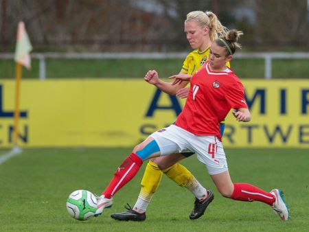 SANKT POELTEN, AUSTRIA - APRIL 13, 2015: Josefine Rybrink (#2 Sweden) and Laura Wienroither (#4 Austria) fight for the ball during a UEFA women's U17 qualifying game.のeditorial素材