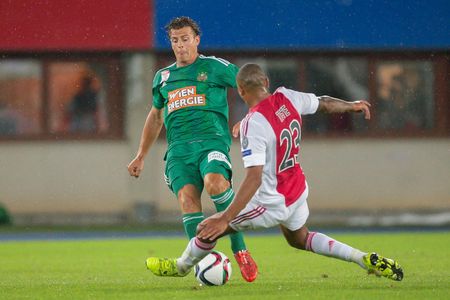 VIENNA, AUSTRIA - JULY 29, 2015: Stefan Schwab (SK Rapid) and Kenny Tete (Ajax) fight for the ball in an UEFA Champions League qualification game.のeditorial素材