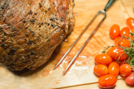 Beef steak medium grilled decorated with tomatoes and green leafs.の写真素材