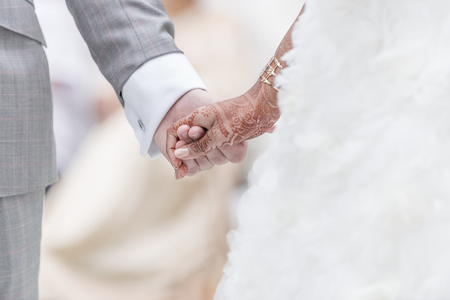 Close-up Holding Hands in indian wedding ritual.の写真素材