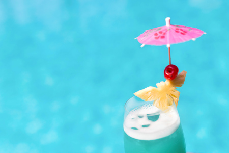 Cocktail glasses at pool, beach side.の写真素材