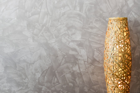 Wall space striped paint brush with weave bamboo LED lamp, useful for background with text space, copy space.の写真素材