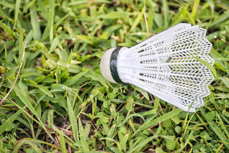 Badminton shuttlecock with plastic feathers on green grassの写真素材