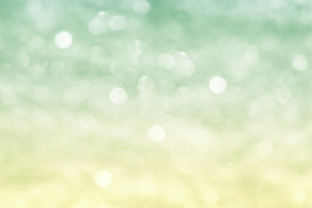 abstract festival background with defocused lights. bio colors light green-yellow.