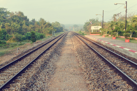 Beautiful sunshine foggy morning at platform of local Thailand train station. Vintage.の写真素材