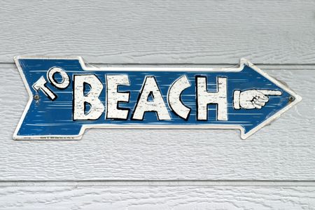 Sign with the text To Beach and a handの写真素材