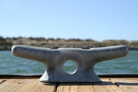 Dock cleats on a pier to tie-up boats.の写真素材