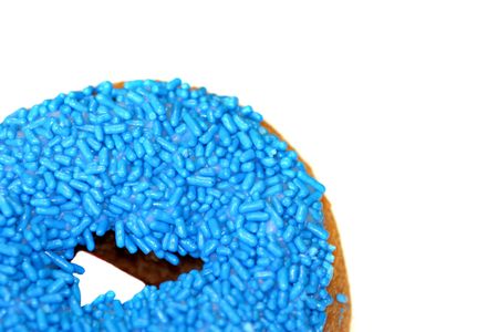 Blue doughnut in bottom left corner on white backgroundの写真素材